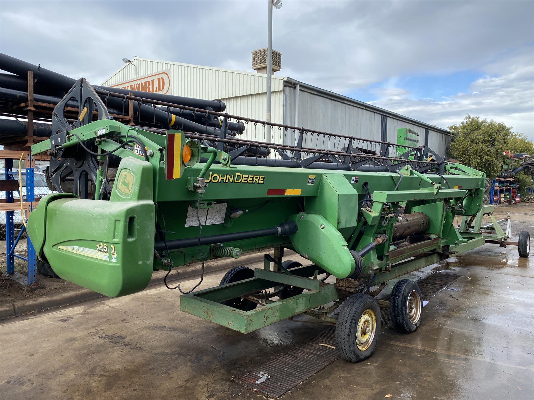 Used John Deere 925D 25ft Draper Front and Trailer For Auction in