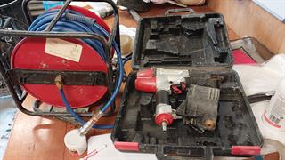 Nail GUN and Air Hose Construction Equipment Photo